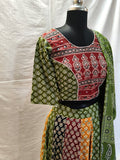 Atrangi Multicolour Ajrak Chaniya Choli with Green Dupatta