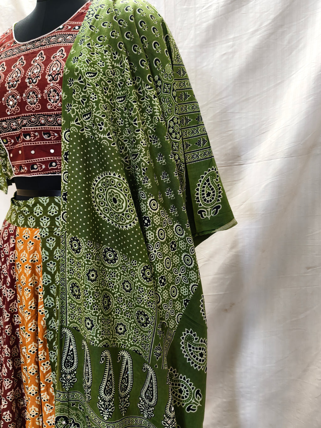 Atrangi Multicolour Ajrak Chaniya Choli with Green Dupatta