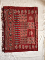 Traditional Ajrak dupatta flat lay with tassels