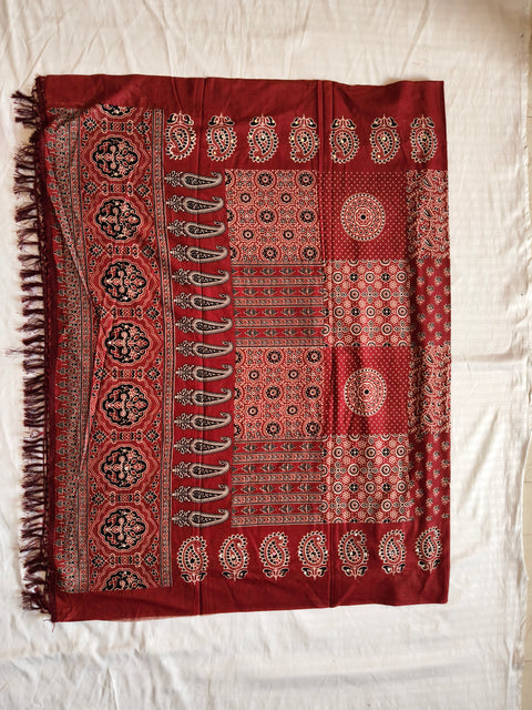 Traditional Ajrak dupatta flat lay with tassels