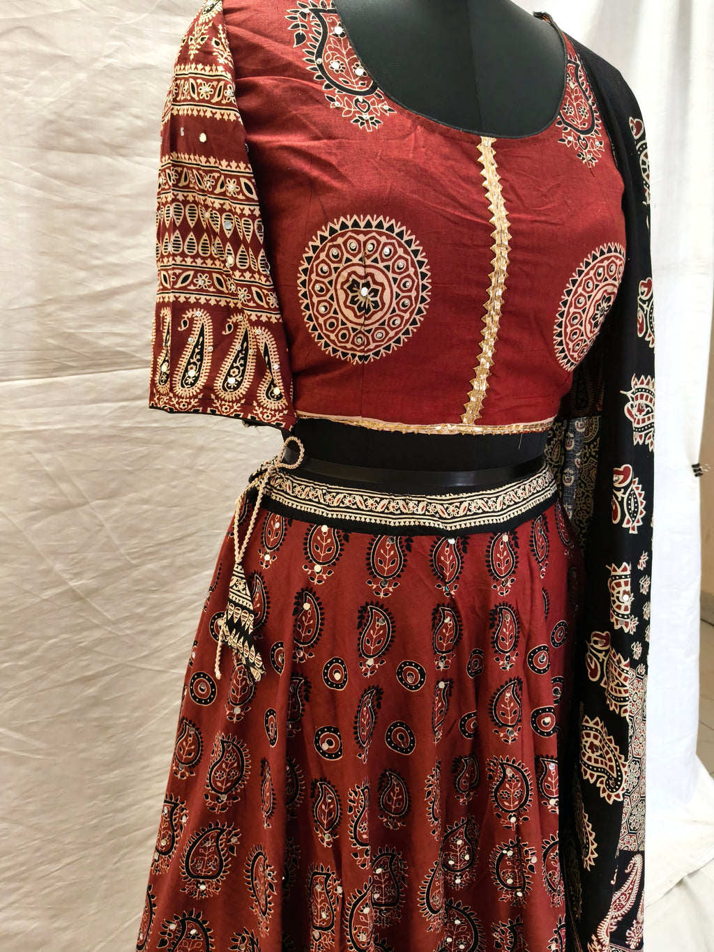 Rust red Ajrak blouse and lehenga close-up