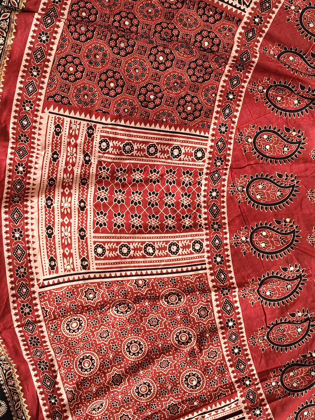 Rust red Ajrak heritage print close-up