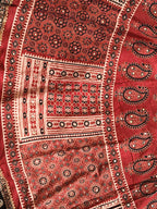 Rust red Ajrak heritage print close-up