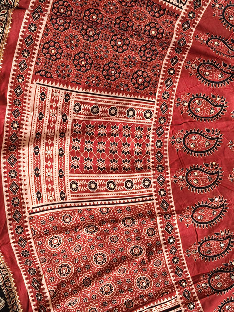 Rust red Ajrak heritage print close-up