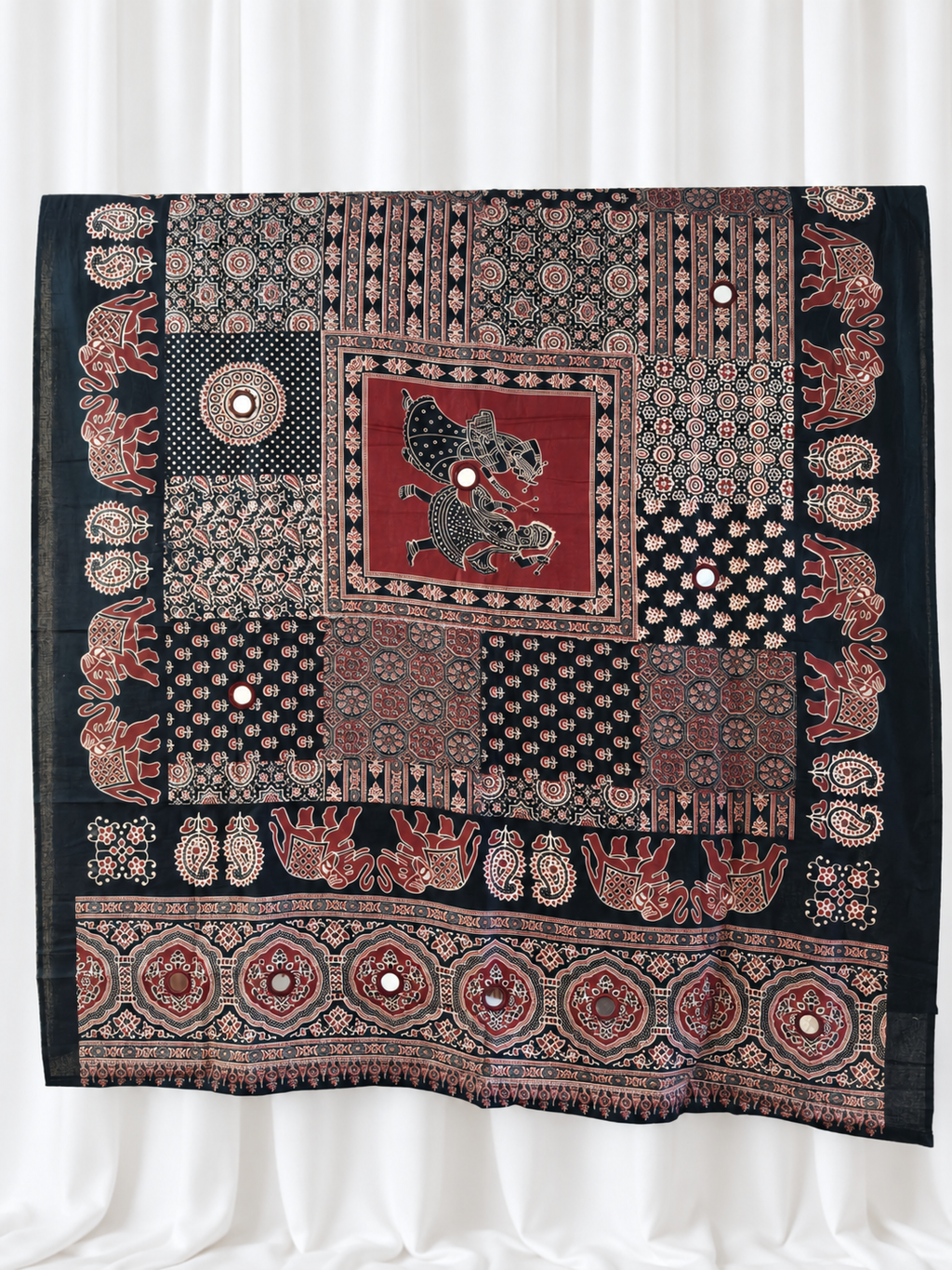 Ajrakh Raas black and maroon cotton dupatta with mirror accents on white curtain background