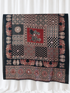 Ajrakh Raas black and maroon cotton dupatta with mirror accents on white curtain background