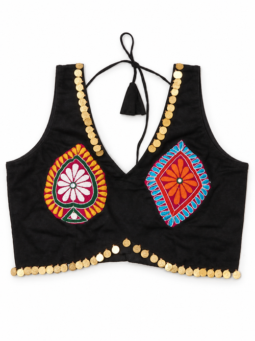 Front view of black sleeveless blouse with colourful motifs and gold coin trim