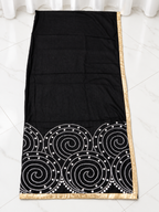 Black spiral fabric with gold border