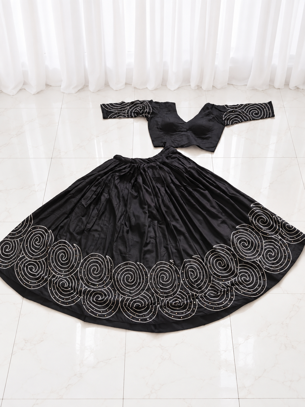 Black spiral mirror work chaniya choli set laid flat