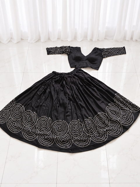 Black spiral mirror work chaniya choli set laid flat