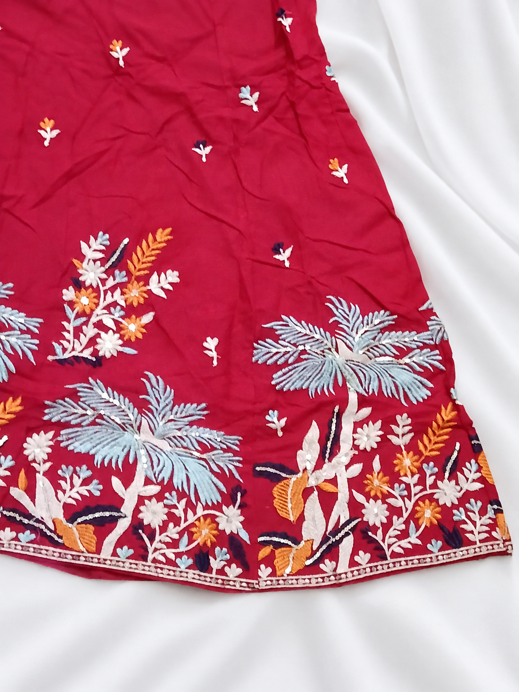 Red ghagara embroidery close-up
