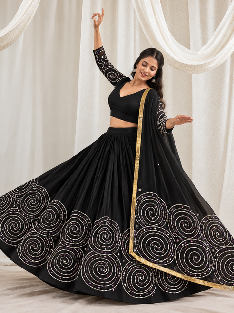 Model wearing Kabhi Leher Leher black spiral mirror work chaniya choli