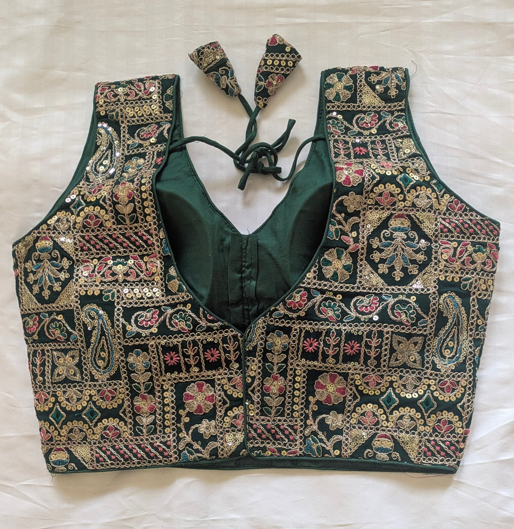 Green embroidered blouse with intricate patterns