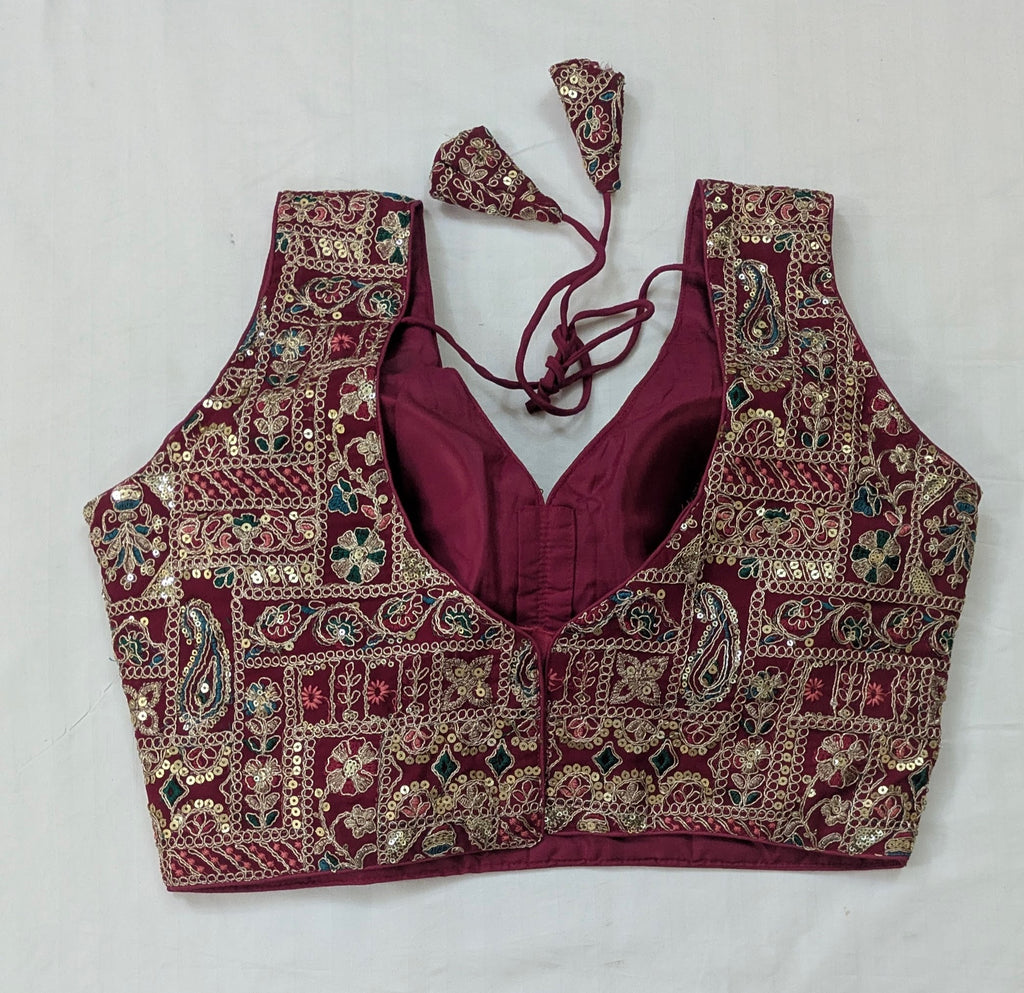 Maroon embroidered blouse with intricate patterns