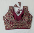 Maroon embroidered blouse with intricate patterns