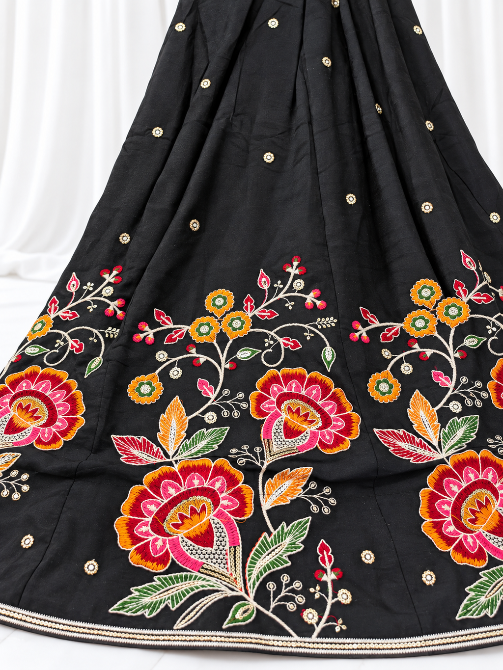 Black ghagara with floral hem embroidery and scattered mirrors