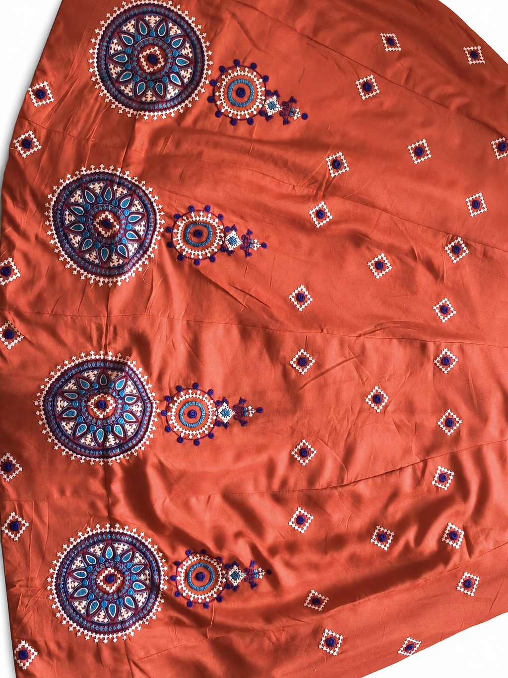 Blue and white circular embroidery detail