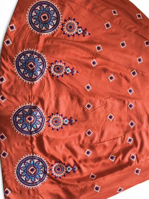 Blue and white circular embroidery detail
