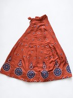 Rust orange embroidered ghagara flat lay