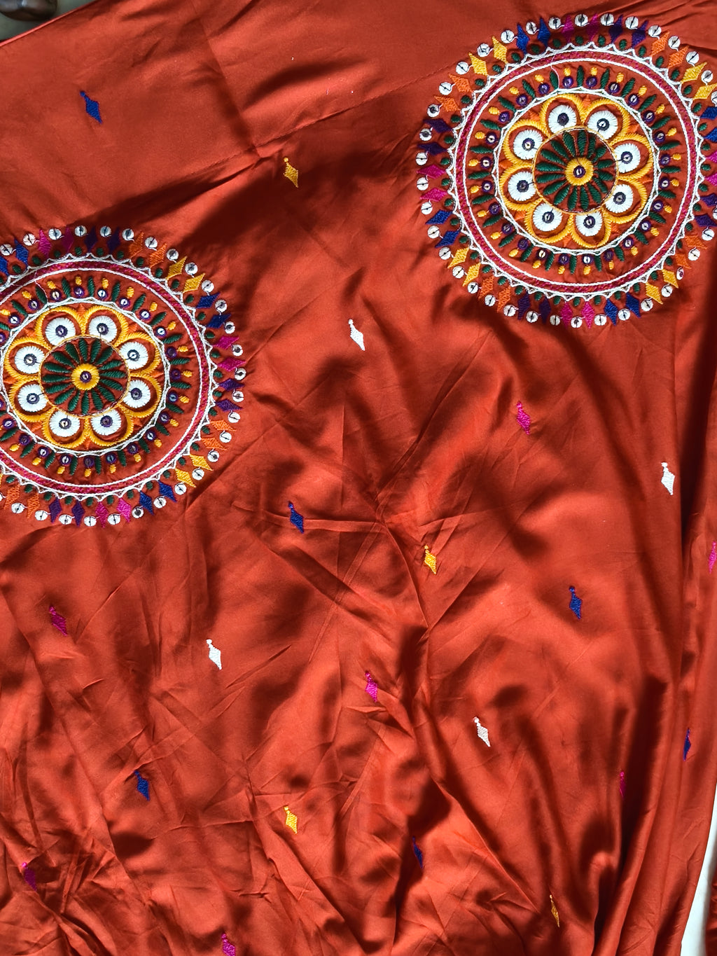 Rust orange lehenga embroidered motif detail