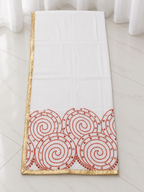 Folded white dupatta with gold border and spiral embroidery