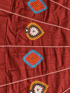 Floral and diamond skirt motif detail