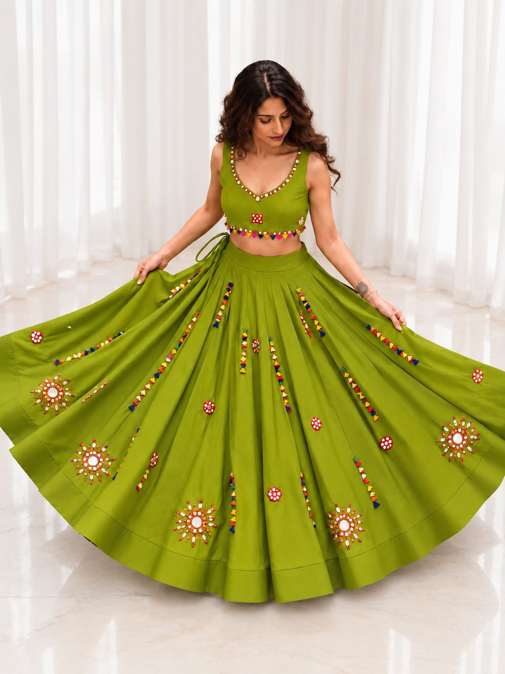 Model wearing olive green mirror work chaniya choli
