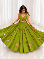 Model wearing olive green mirror work chaniya choli