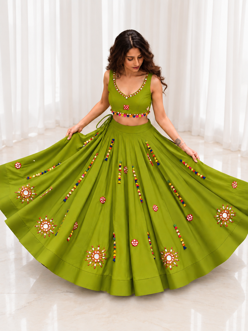 Model wearing olive green mirror work chaniya choli