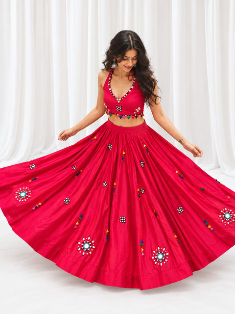 Model wearing hot pink mirror work chaniya choli